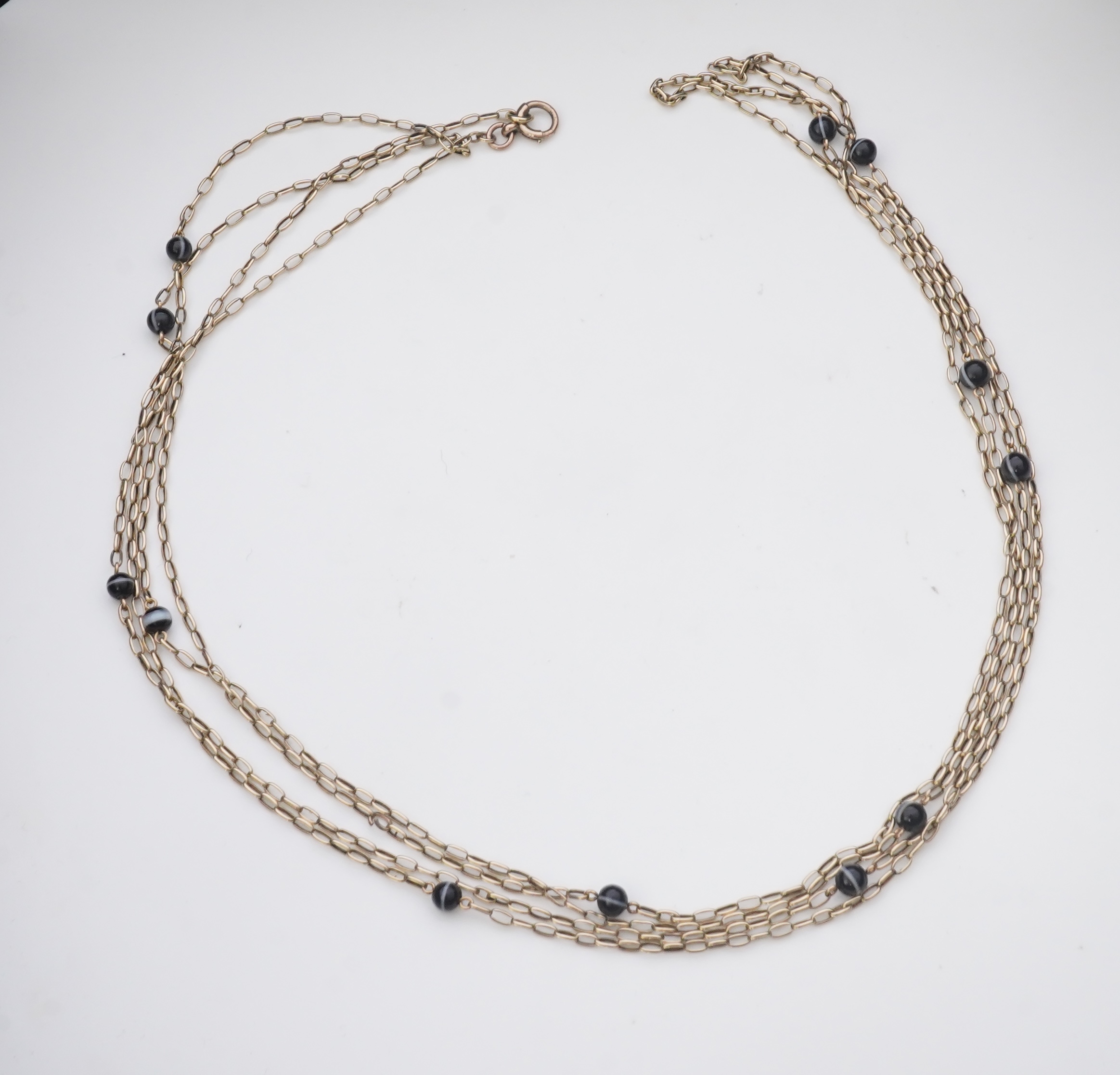 An elegant onyx longchain necklace, early 20th century